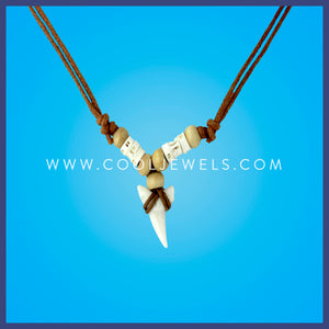 Comes with assorted shark teeth.